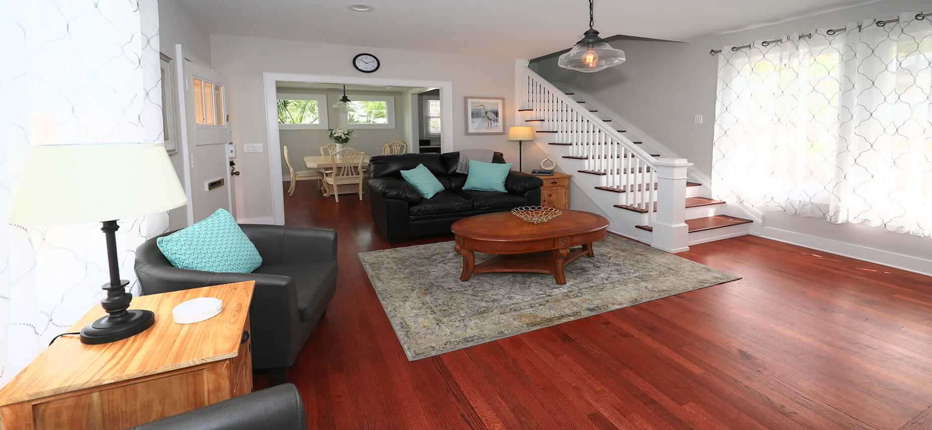 Cozy lounge with leather sofas and dining room view