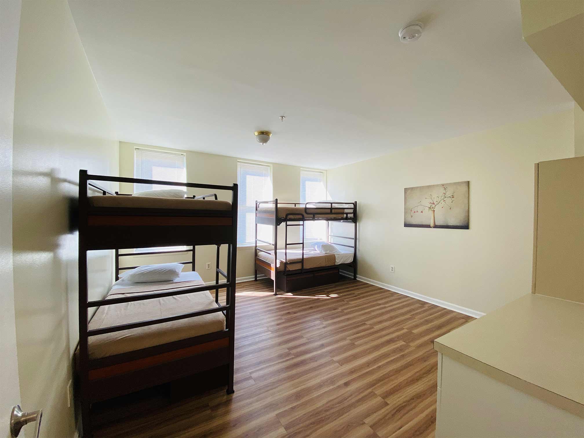 Shared bedroom with two sets of bunk beds