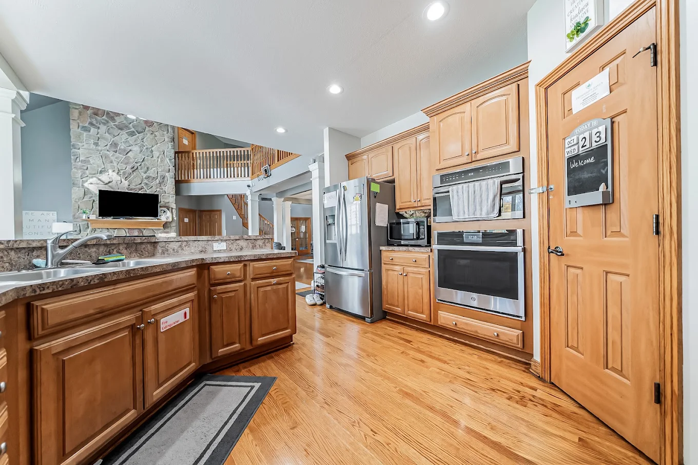 Residential kitchen with wood cabinets and stainless appliances