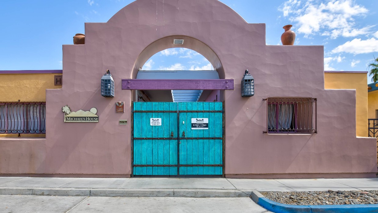 Southwestern-style entrance with turquoise gates