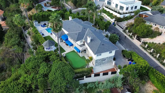 Aerial view of rehab facility with pool, gazebo, and greenery
