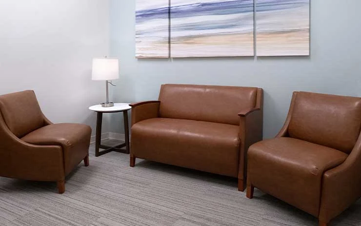 Private therapy room with chairs and soft lighting