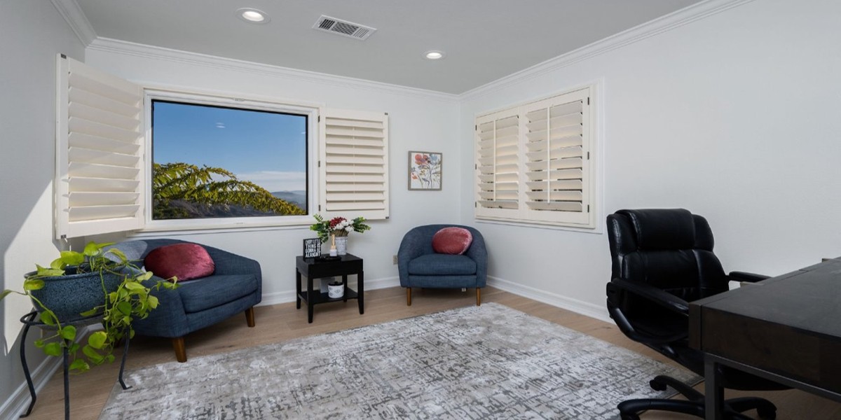 Cozy counseling room with ocean view and blue chairs
