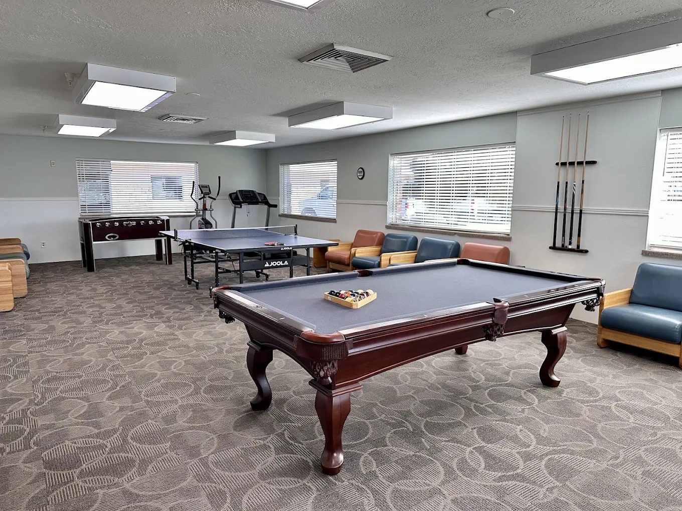 Recreational room featuring pool table, ping pong table, foosball, and seating at New Roads Behavioral Health