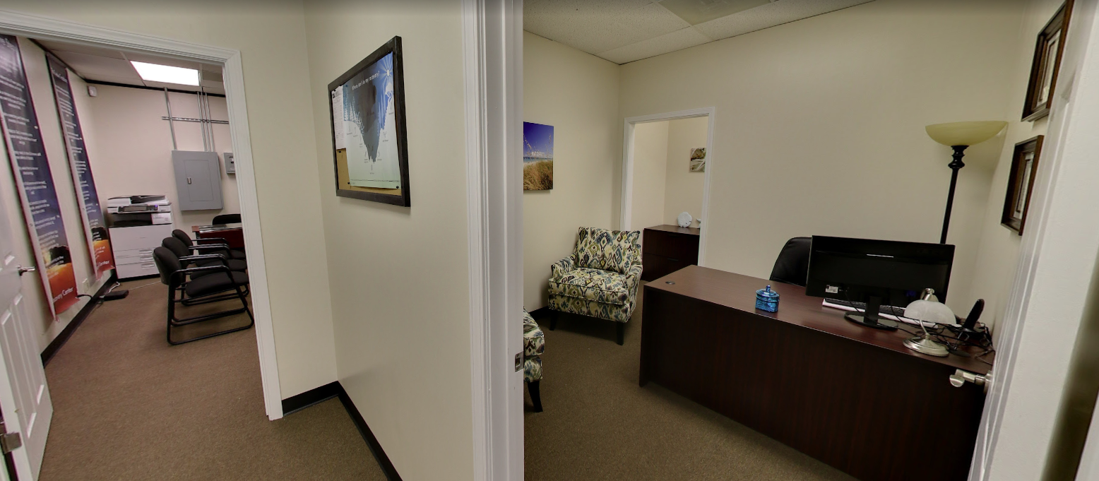 Office with desk, chair, and patterned armchairs