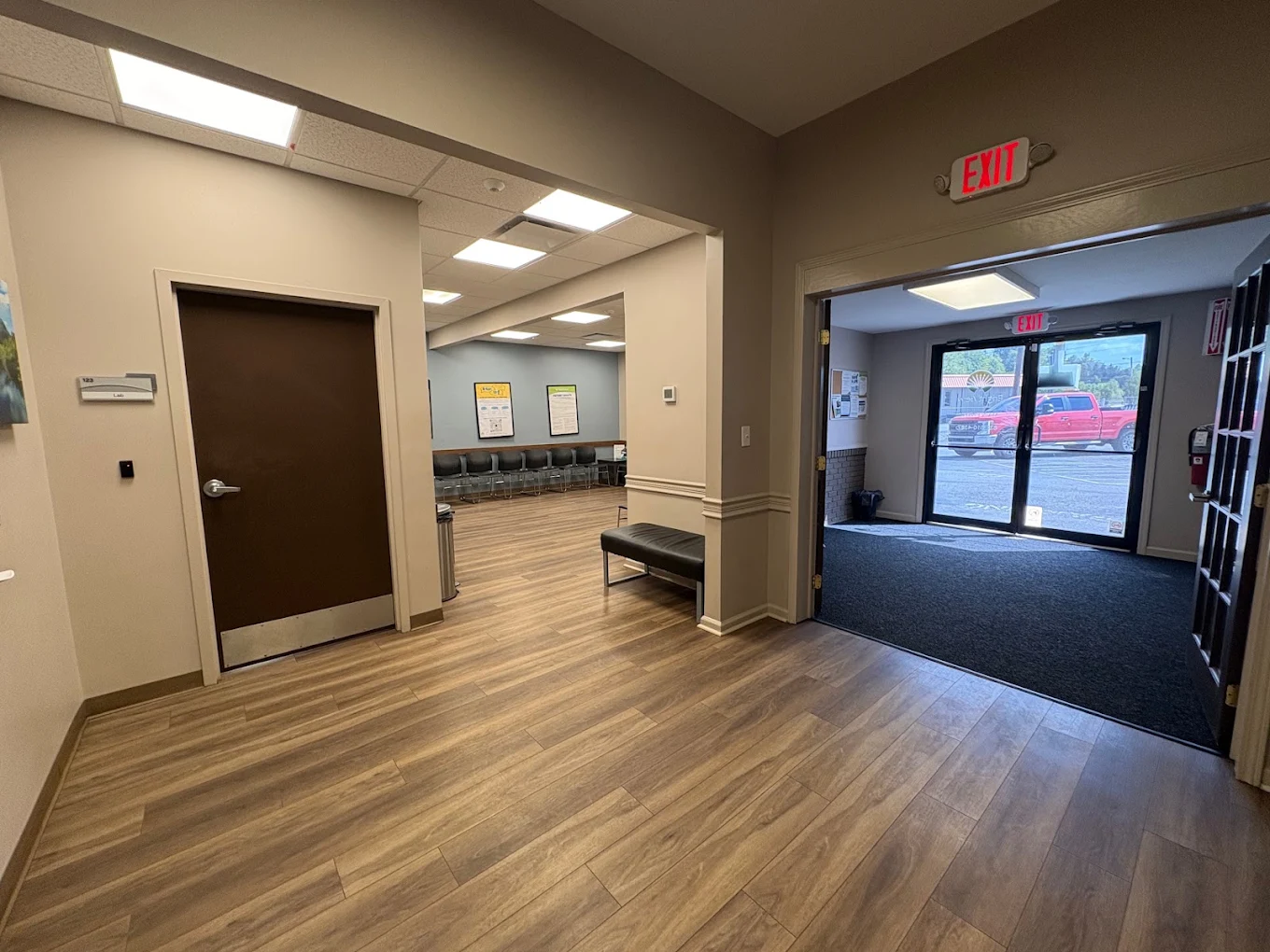 Entrance lobby with seating area and glass exterior doors