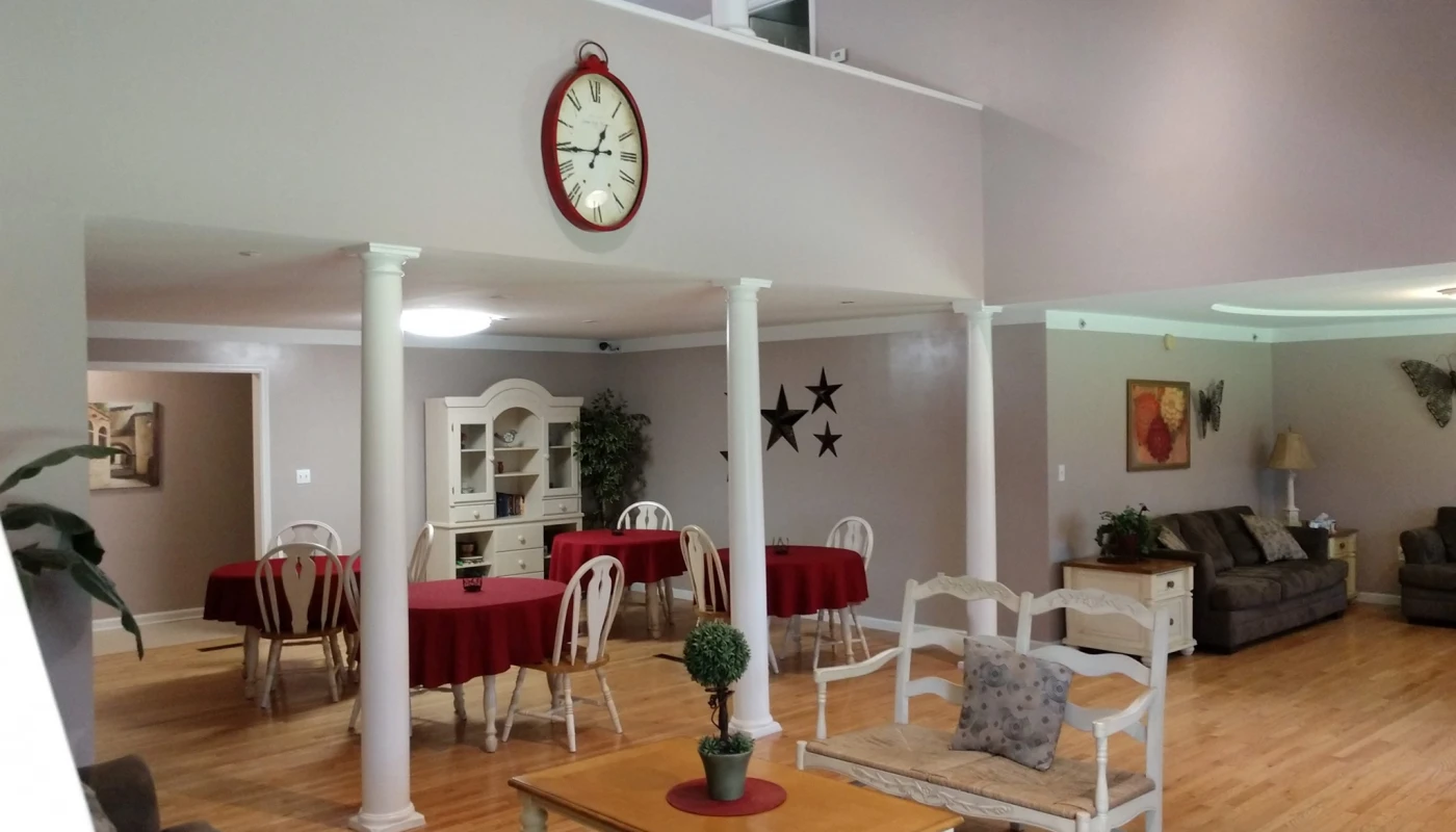 Tables with red cloths and couches in shared lounge area