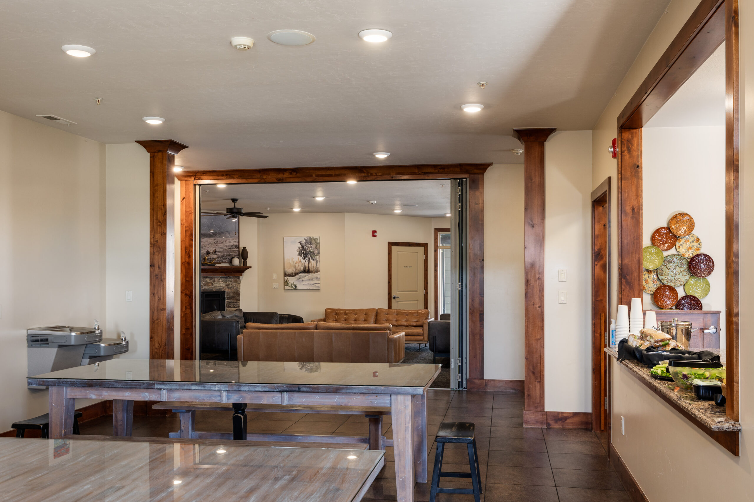 Open dining space with wood tables and lounge view