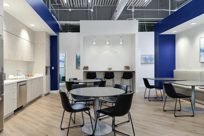 Dining space with round tables and black chairs