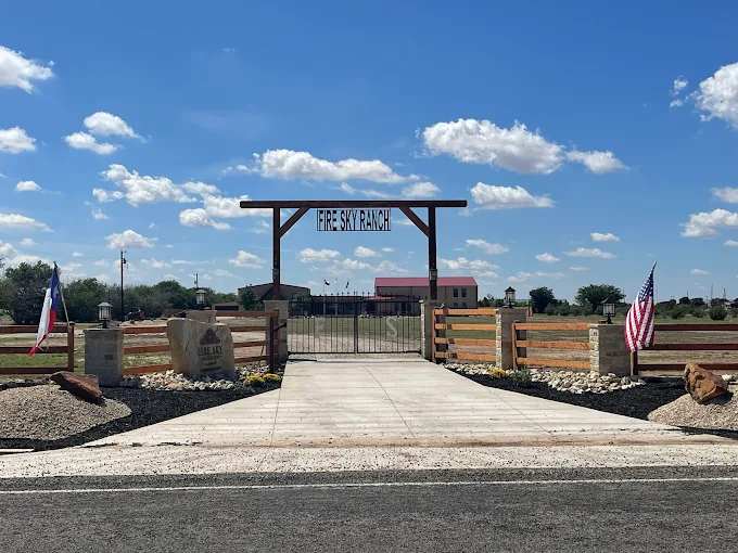 Entrance gate and driveway leading to Fire Sky Recovery