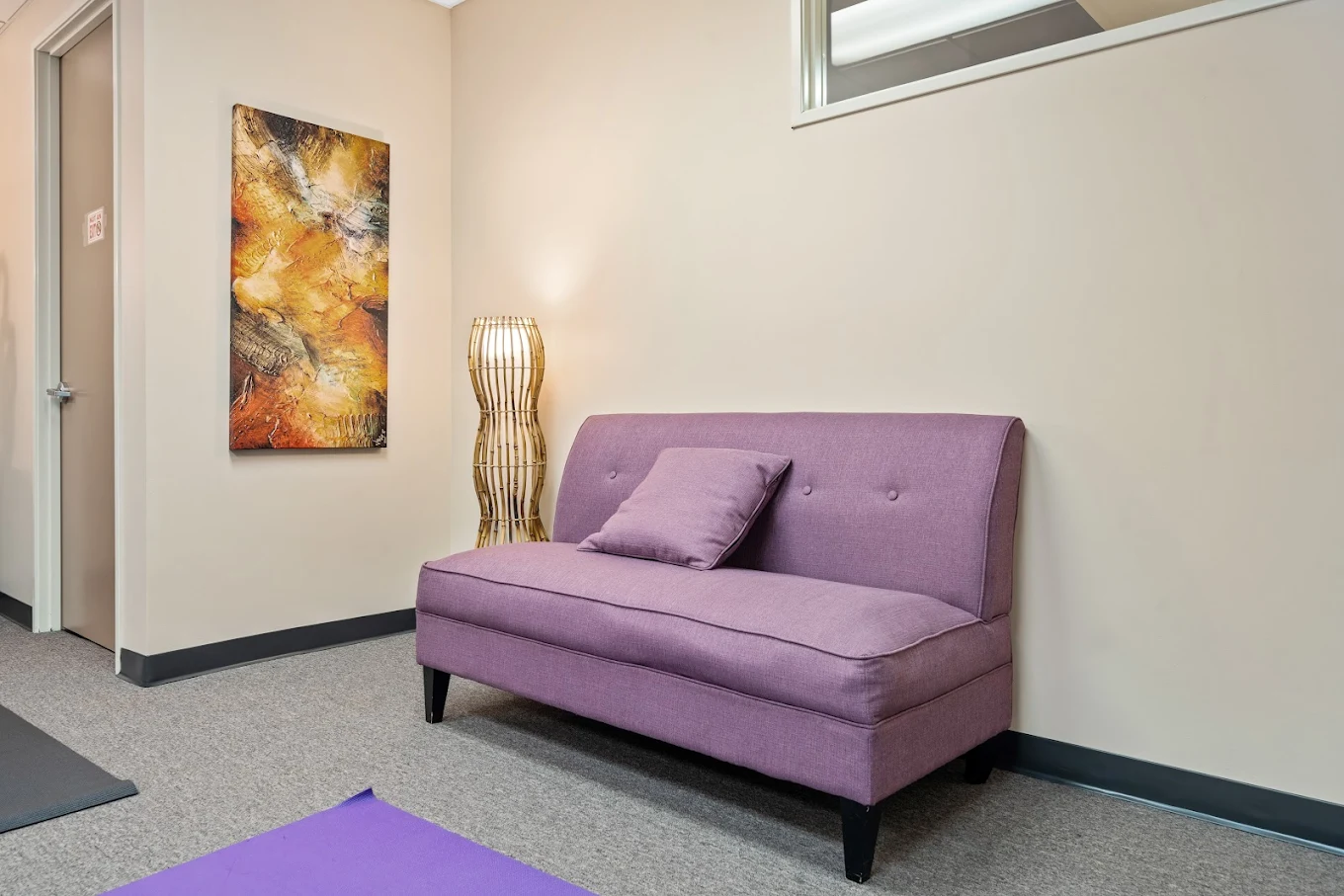 Wellness room with sofa and calming decor