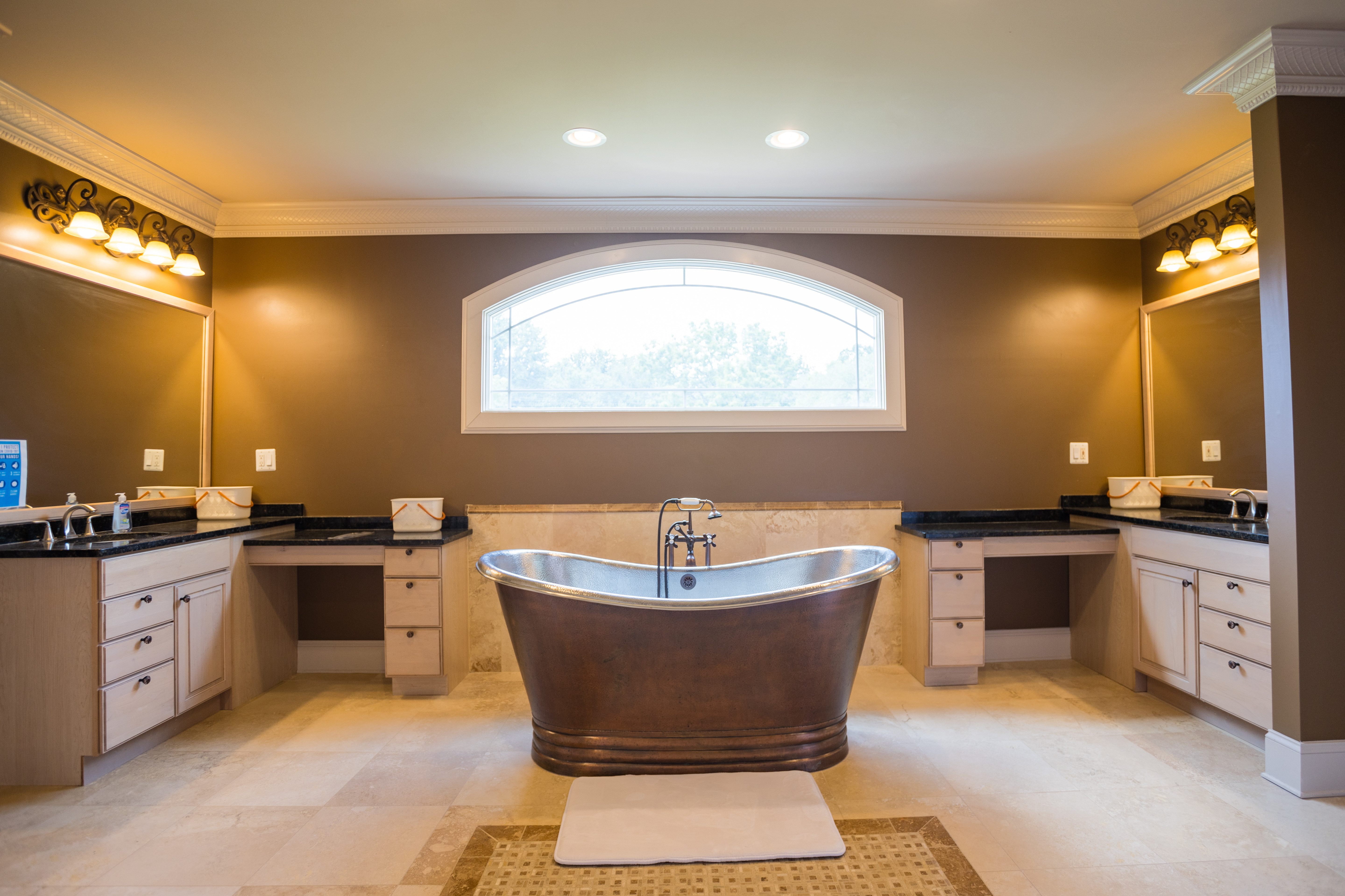 Rehab bathroom with copper tub and dual vanities