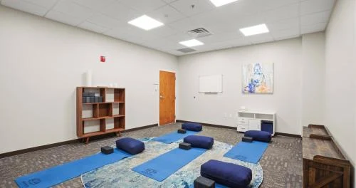 Yoga room with mats and cushions
