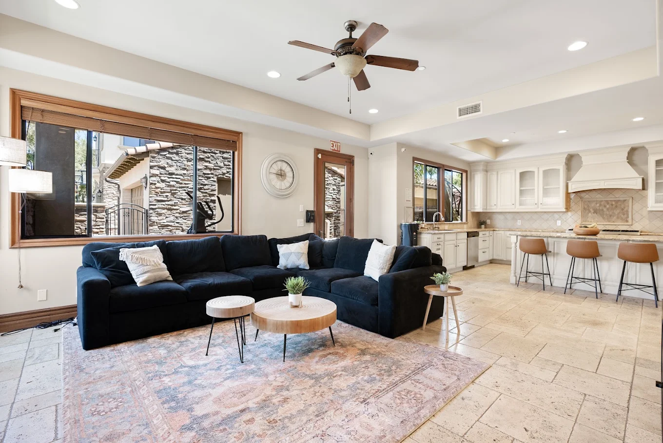 Open living area with sectional sofa and adjoining kitchen