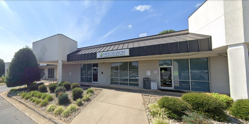 New Season Hickory Metro Treatment Center exterior features modern design, large windows, and a landscaped entrance under a clear sky.