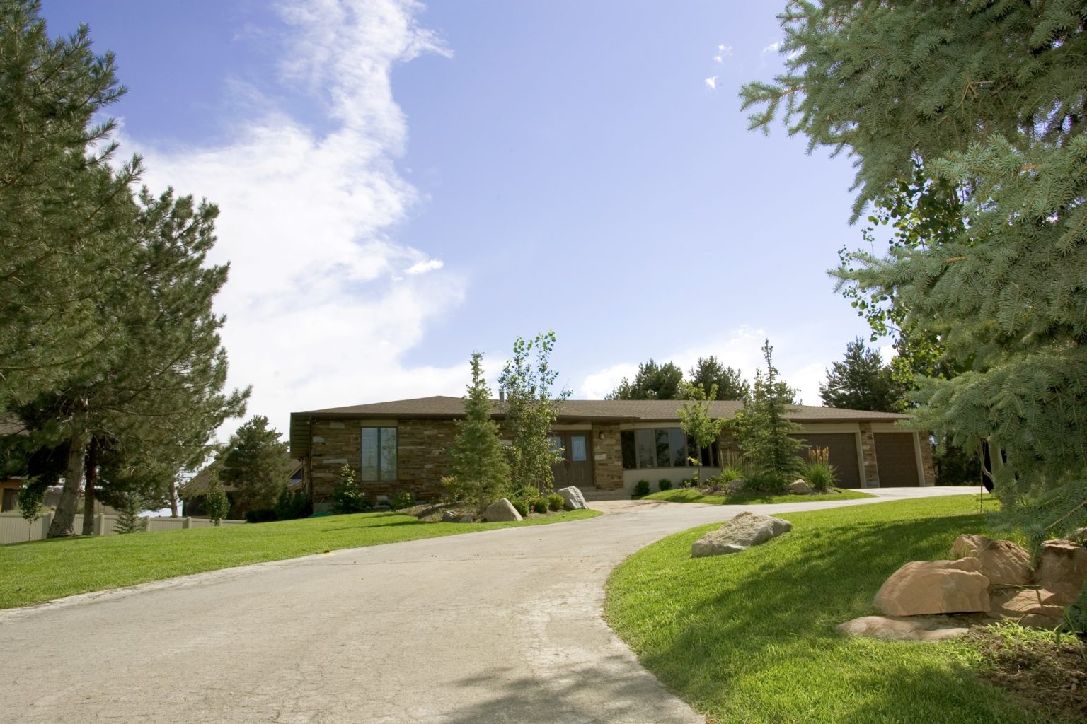 Residential treatment home with driveway and landscaping