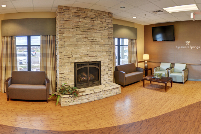 Cozy lobby with stone fireplace and seating