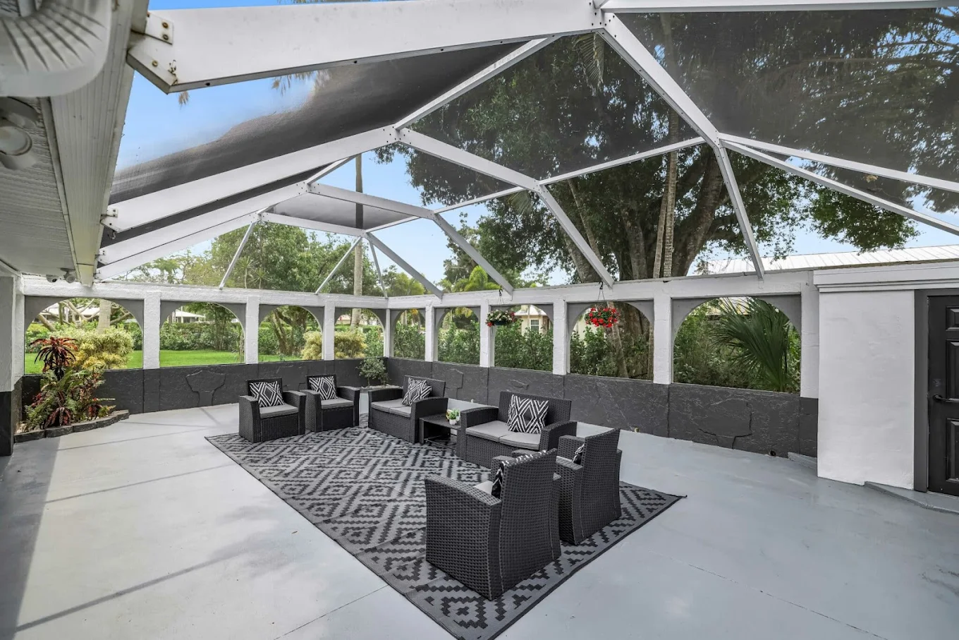 Screened patio with comfortable outdoor seating