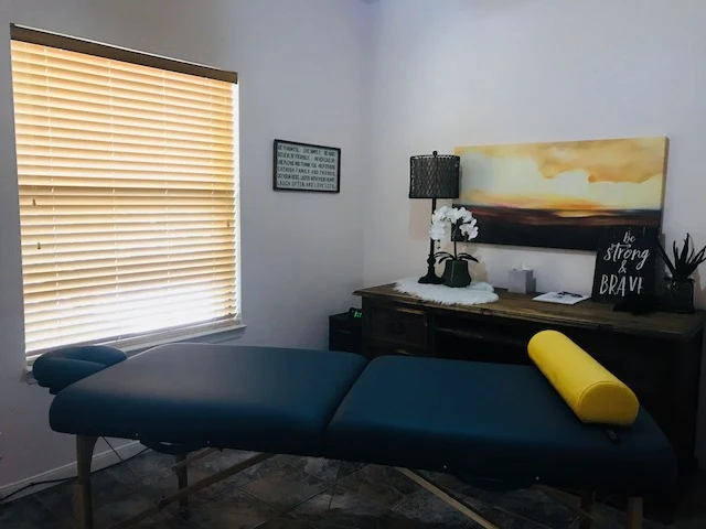 Therapy room with massage table and calming decor