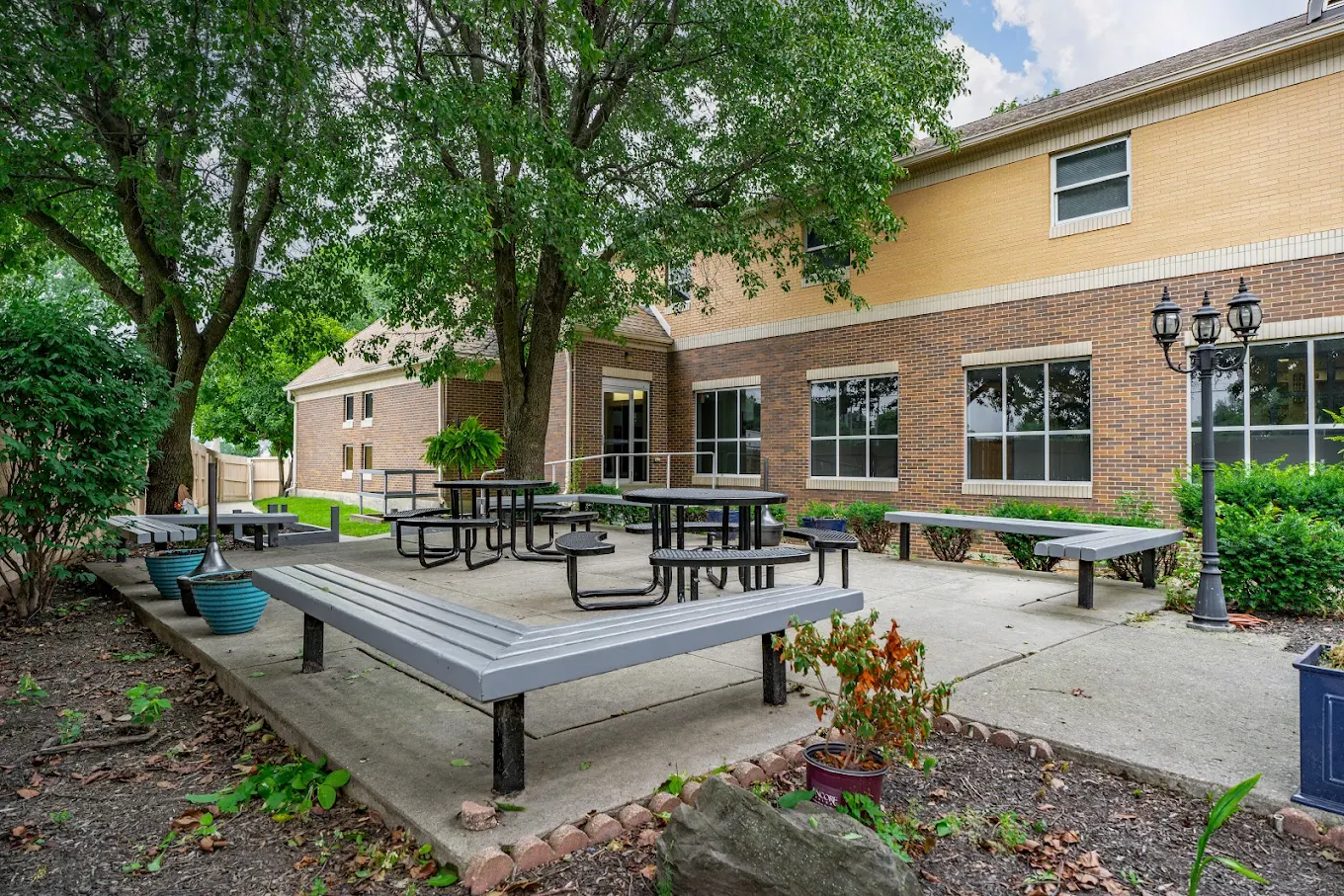 Outdoor courtyard with benches and picnic tables