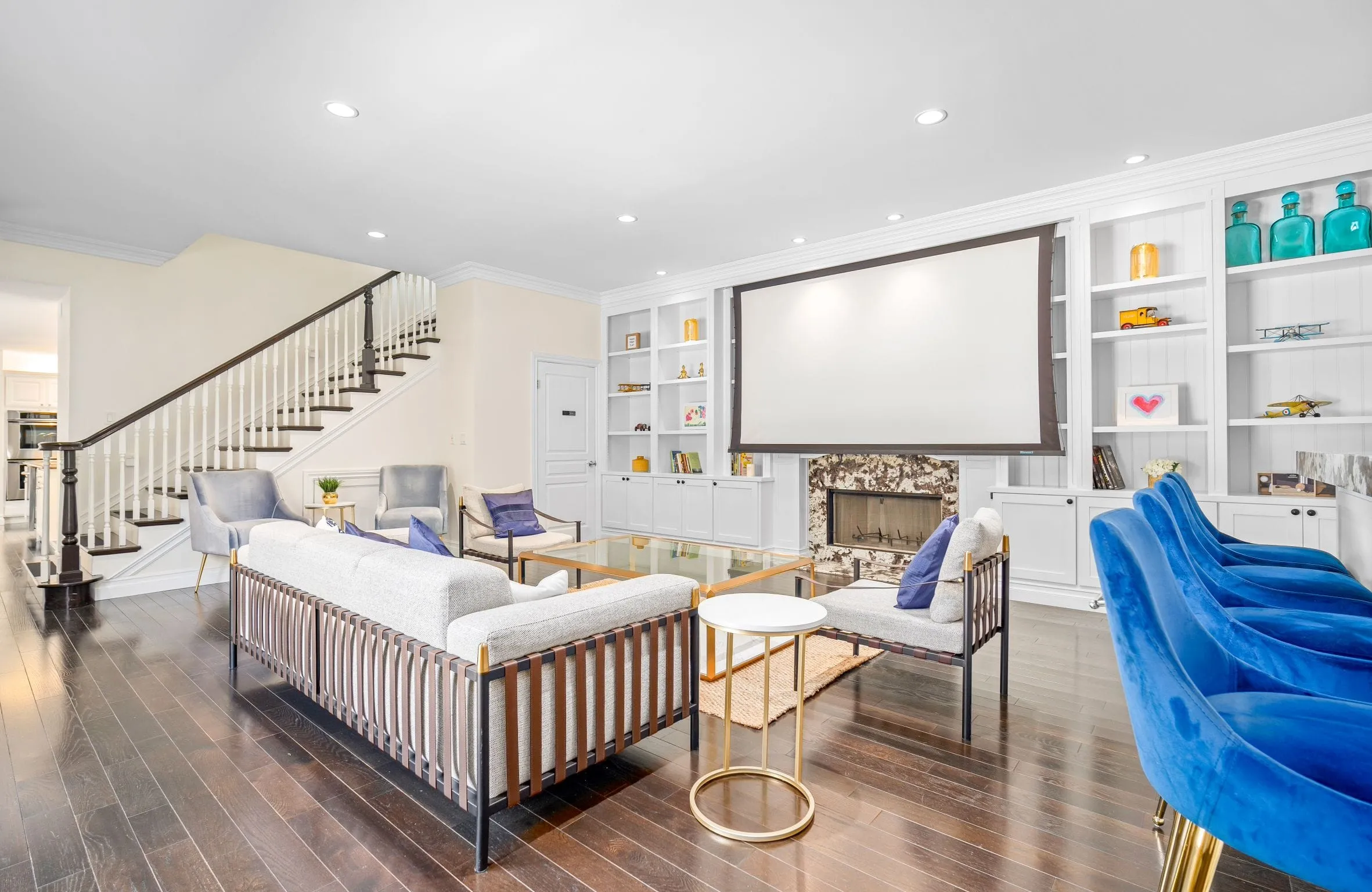 Large lounge with seating and screen at Innovate Recovery