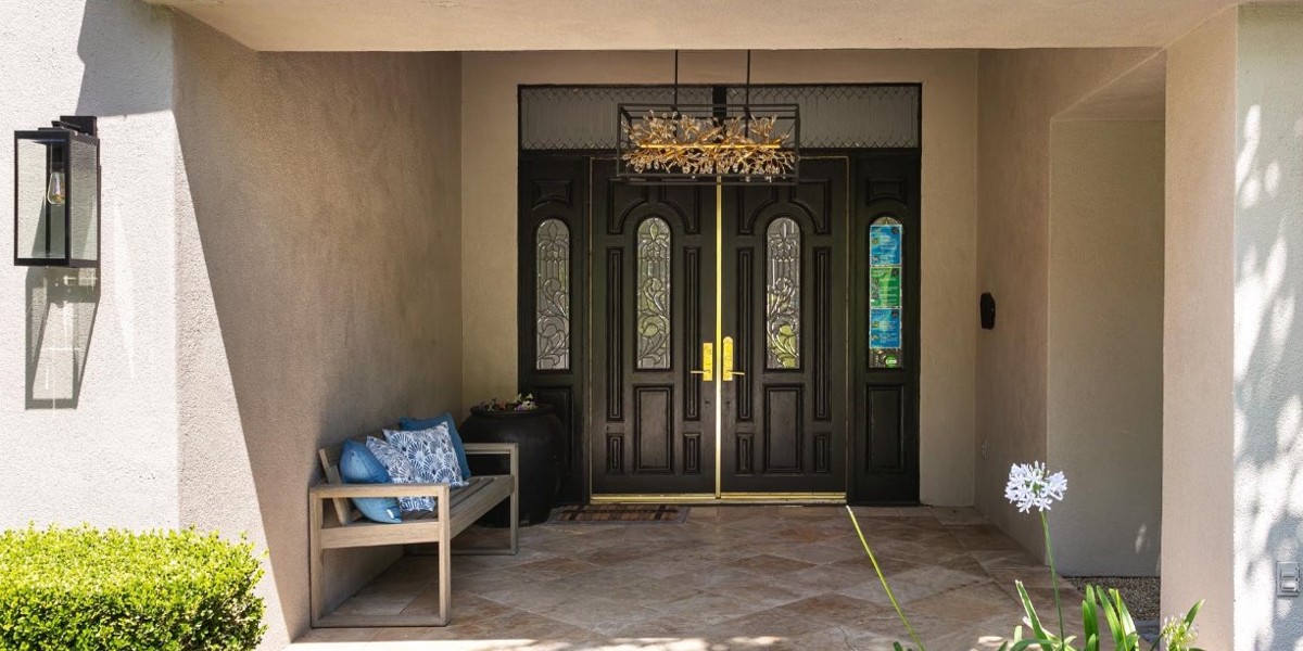 Covered front entryway with double doors and seating bench