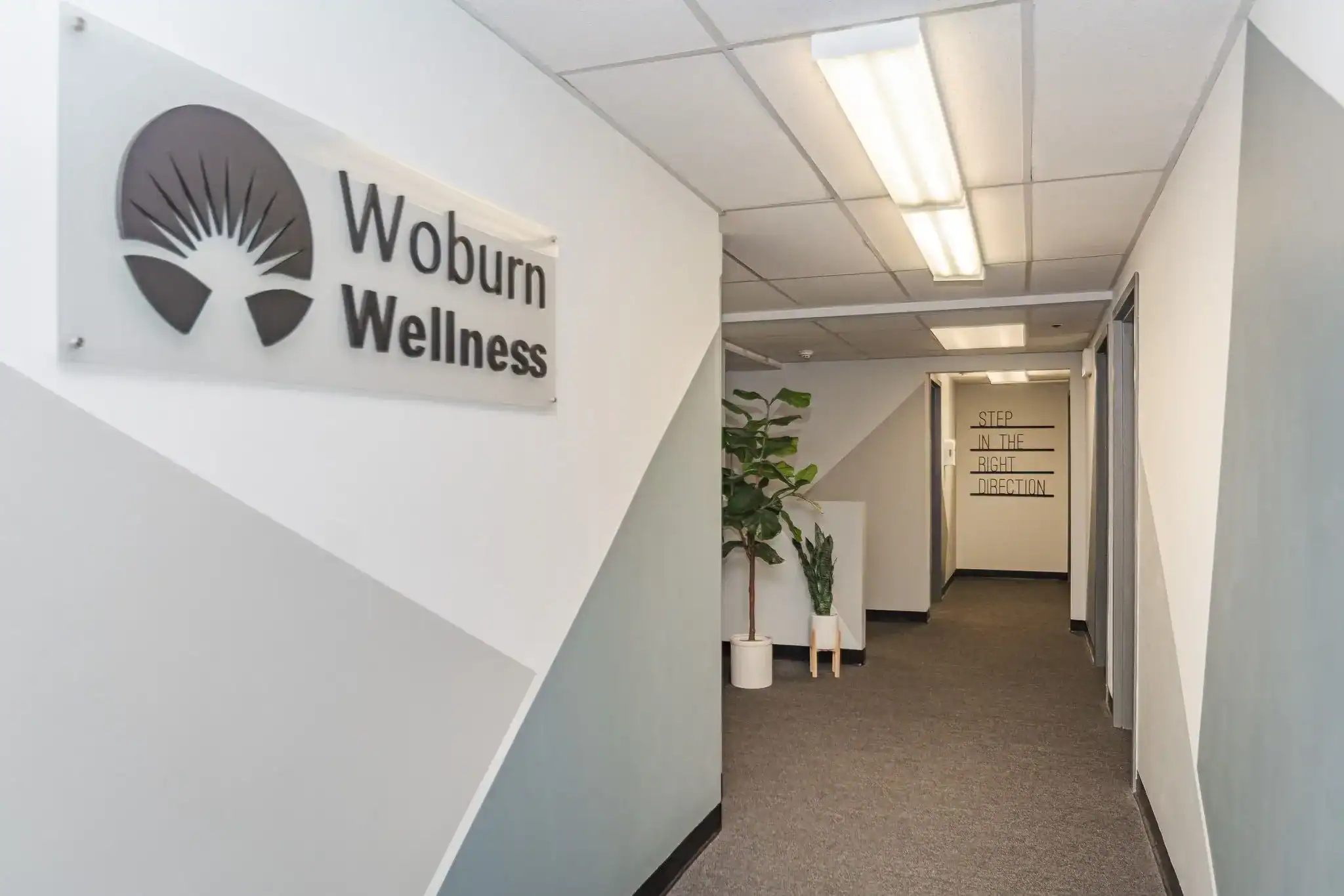 Hallway entrance with Woburn Wellness signage
