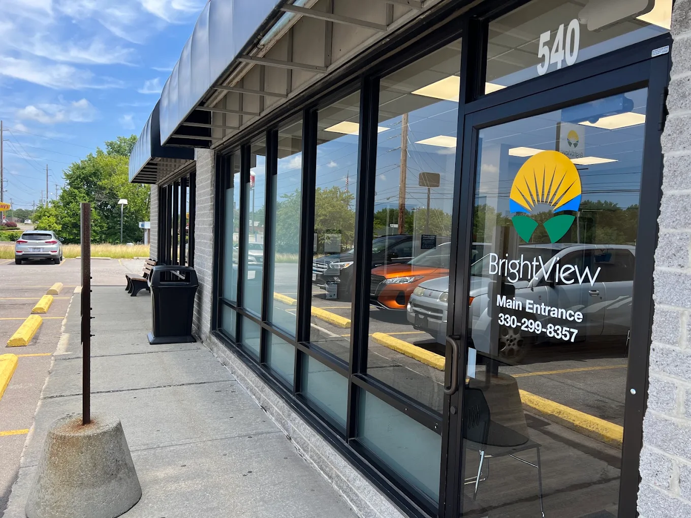 BrightView Elyria addiction treatment center entrance with glass storefront, BrightView logo, and main entrance door