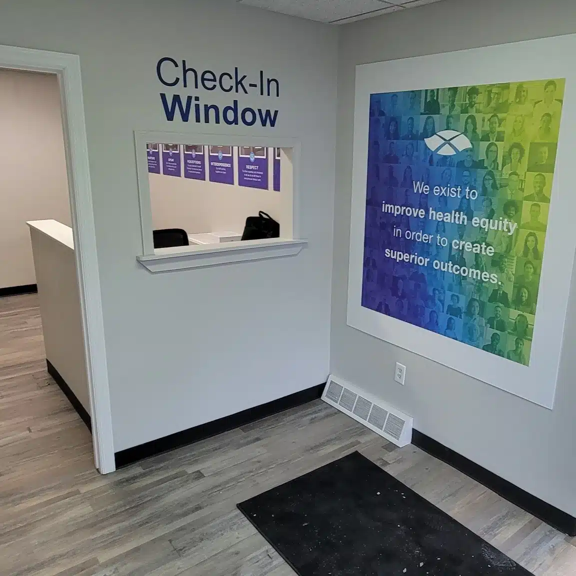 Check-in window with signage and recovery message wall