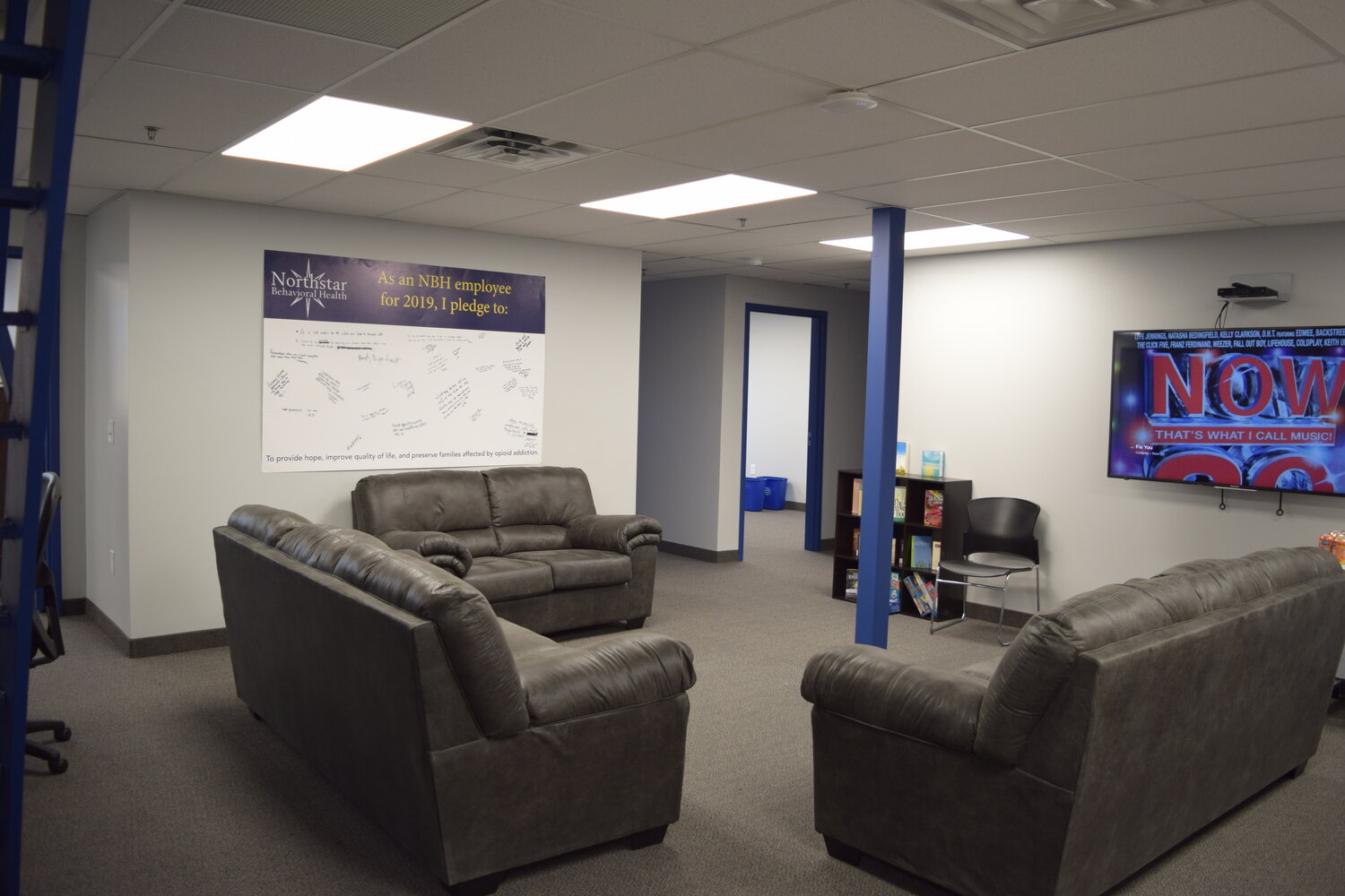 Small reception with armchair and rustic wood décor