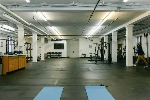 Spacious gym with workout machines and free weights