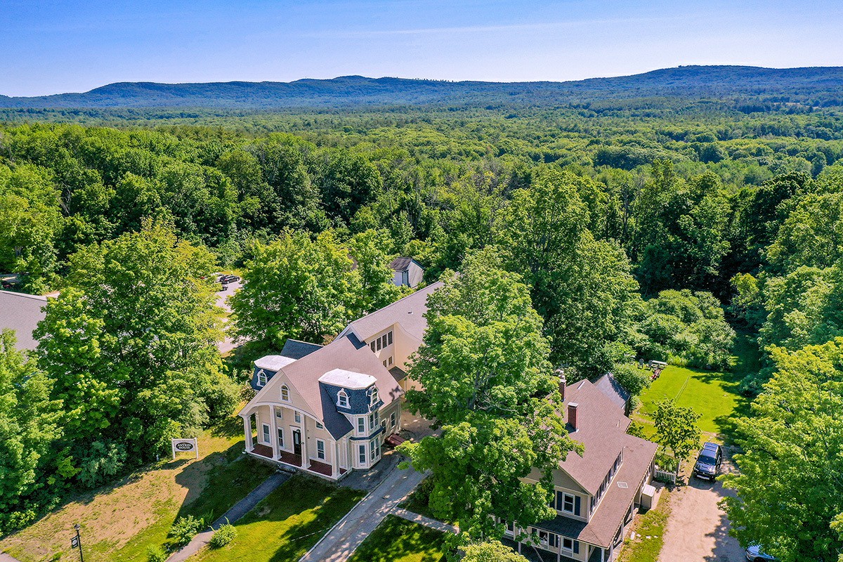 Aerial view of facility surrounded by trees
