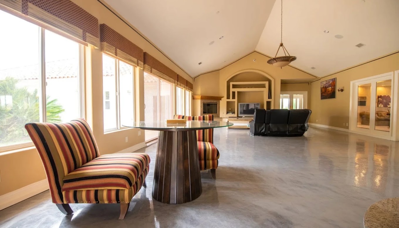 Lounge with striped chairs and large windows