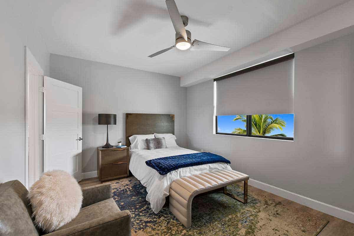 Private bedroom with balcony view and modern furnishings