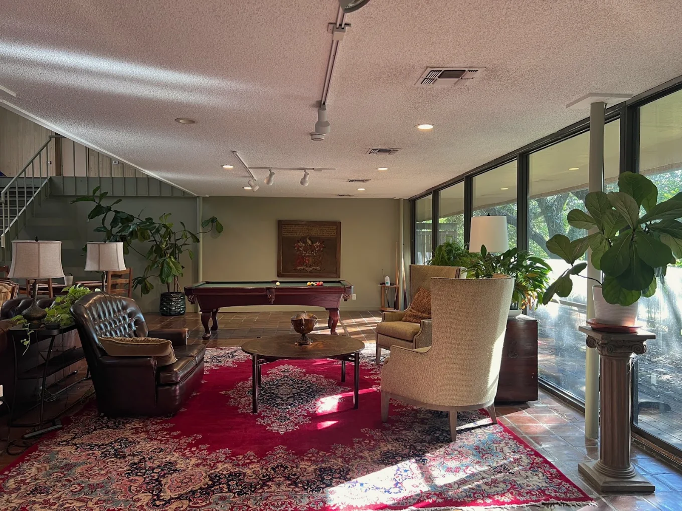 Recreation lounge with pool table and comfortable seating