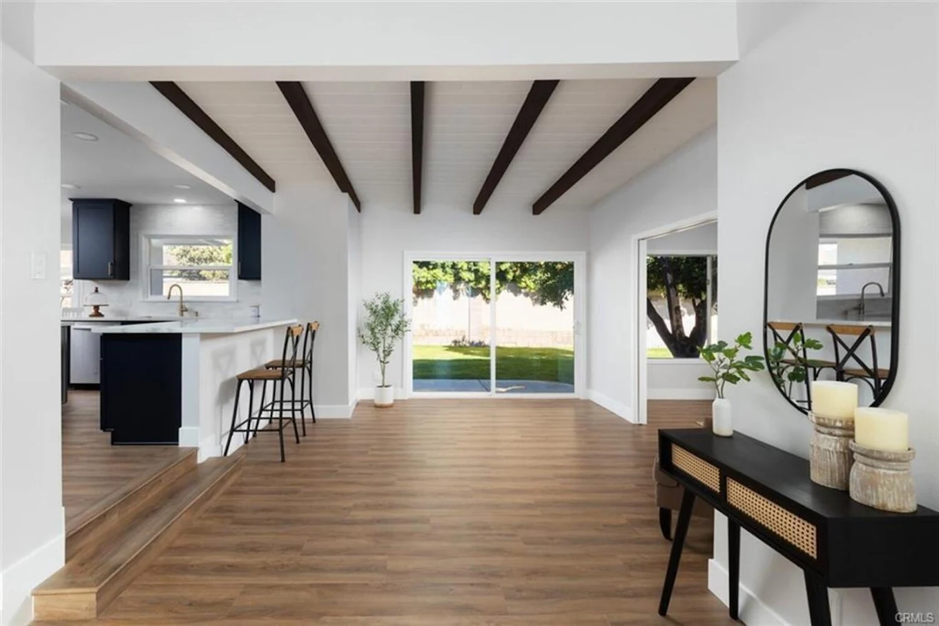 Bright hallway leading to kitchen and outdoor area