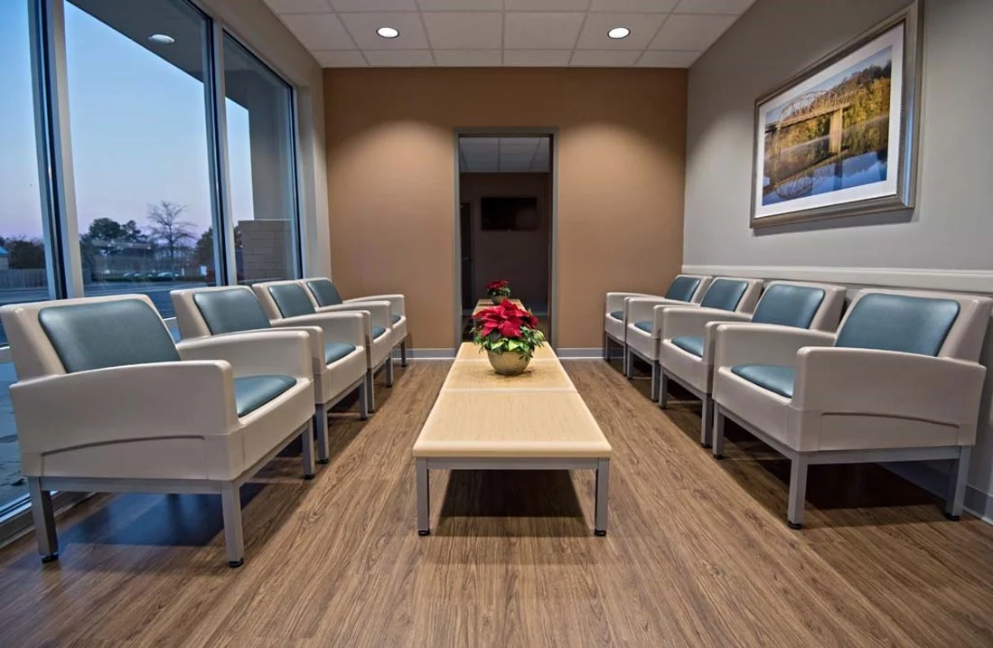 Comfortable waiting area with chairs and coffee table