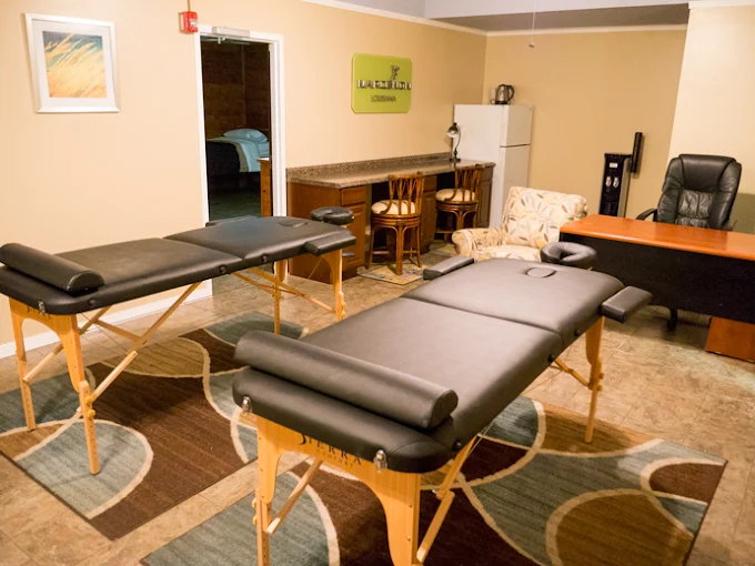 Spa room with massage tables and comfortable decor