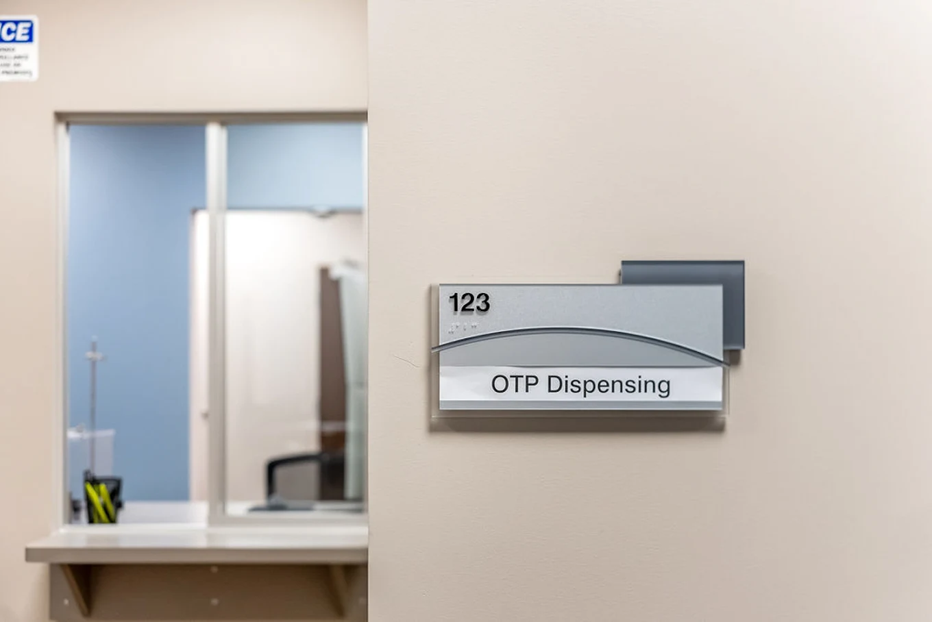 OTP dispensing area at BrightView Health with room 123 sign and service window