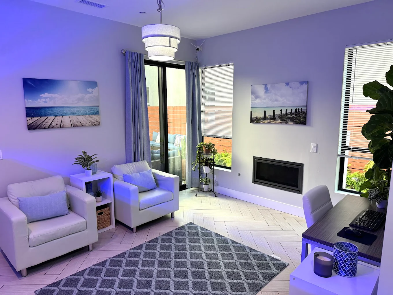 Cozy lounge with white chairs and wall art