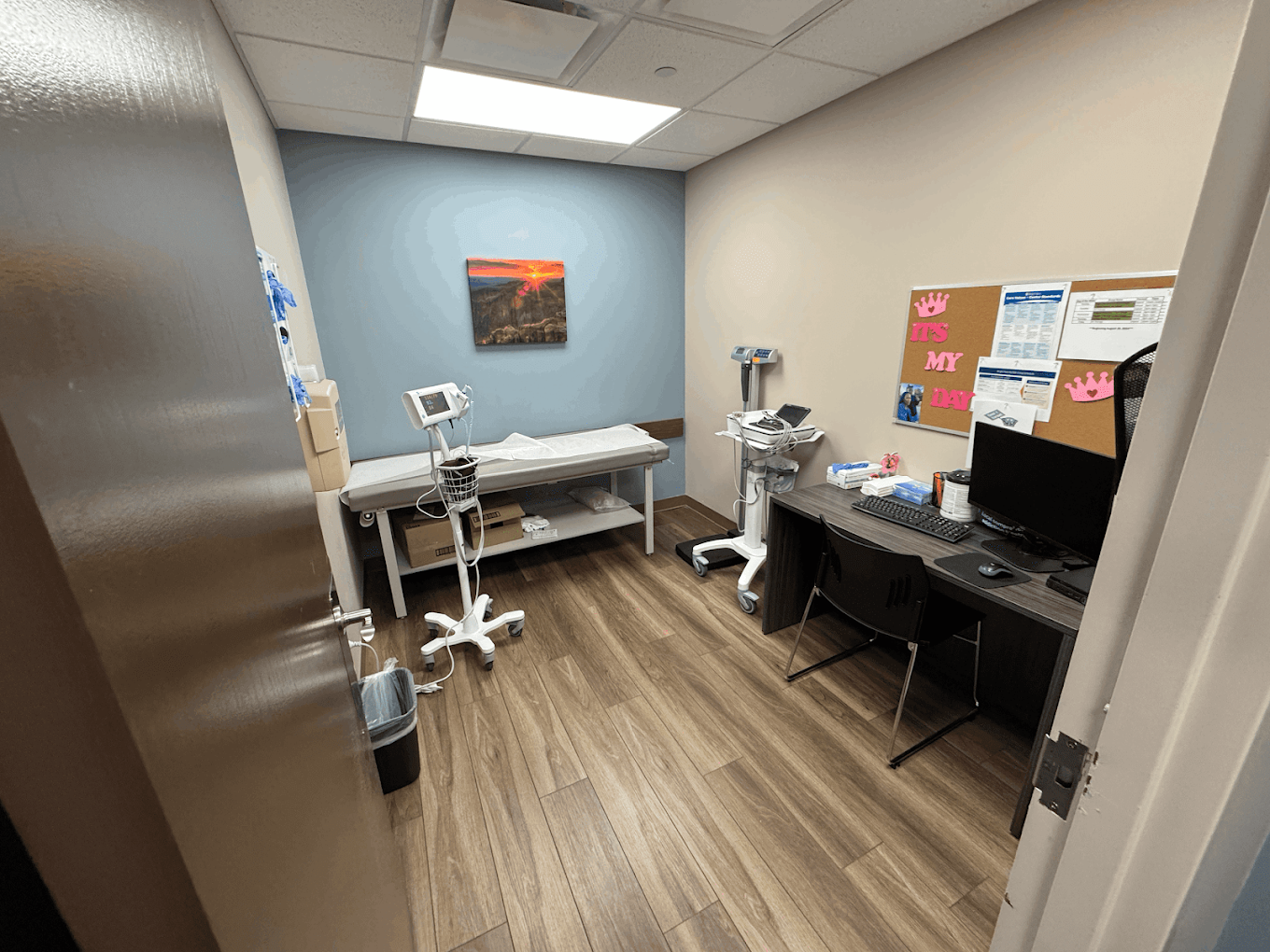 Exam room with examination table and medical equipment