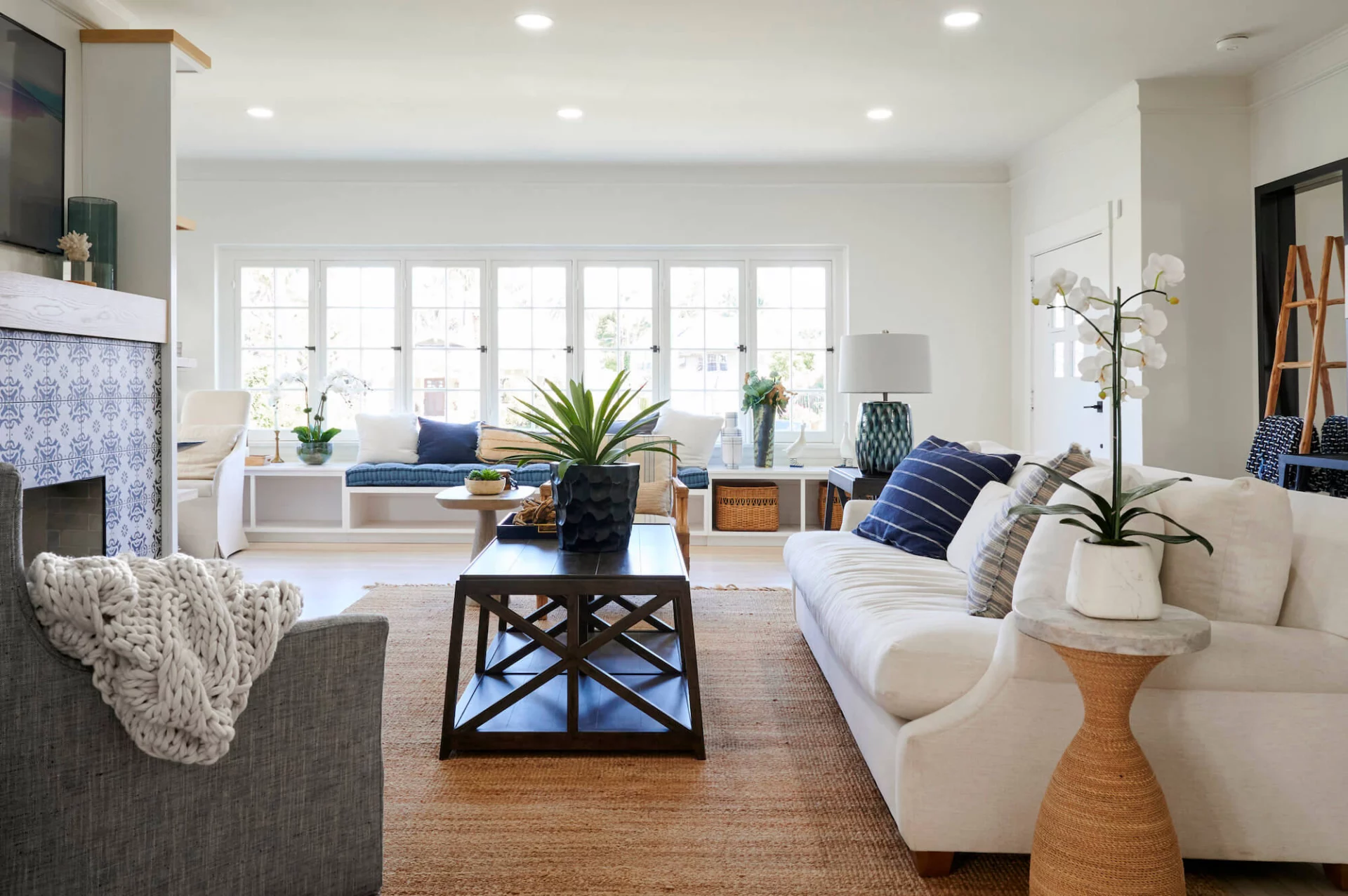 Bright living room with sofas and large windows