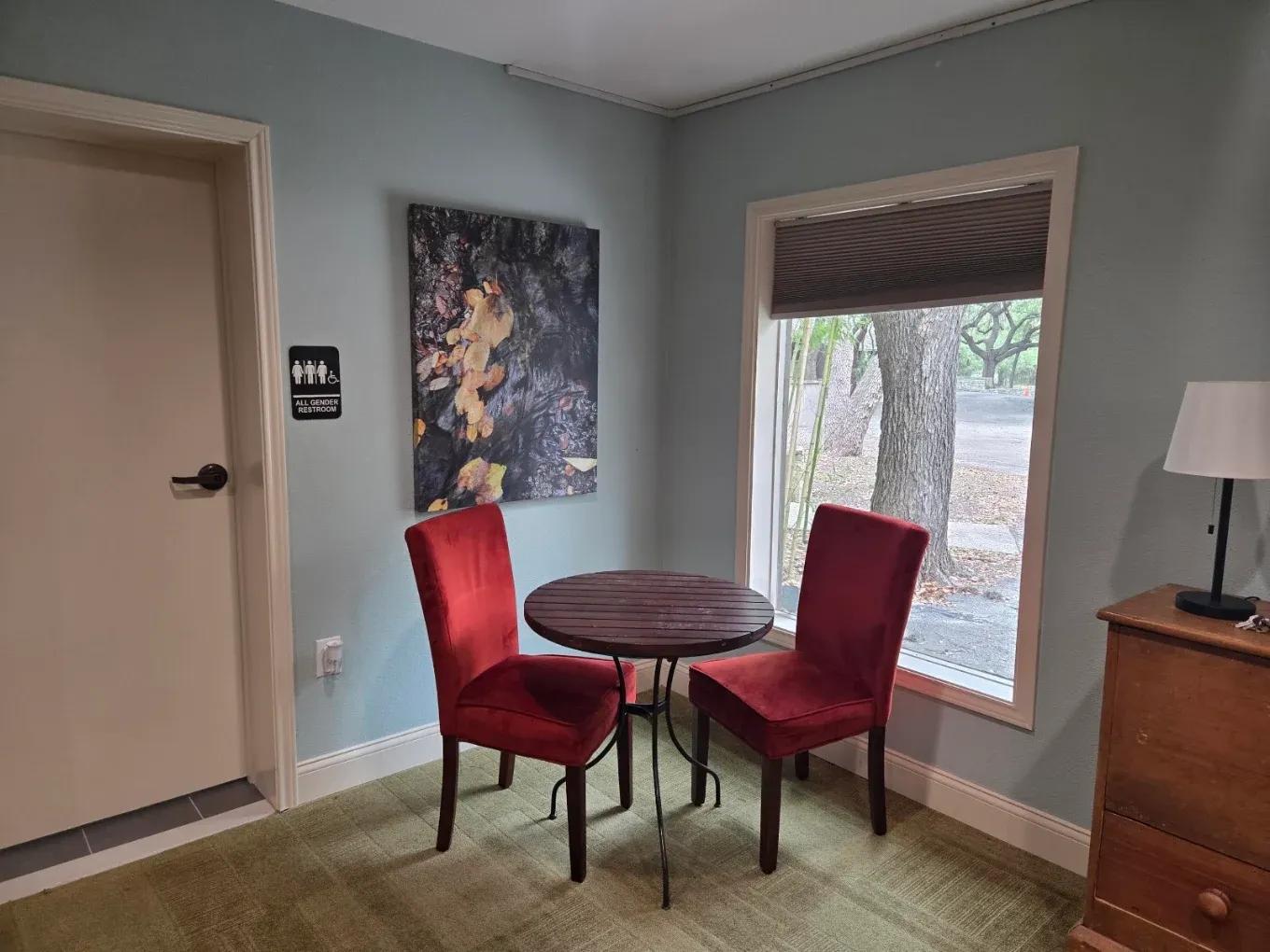 Private consultation area with table, chairs, and window view