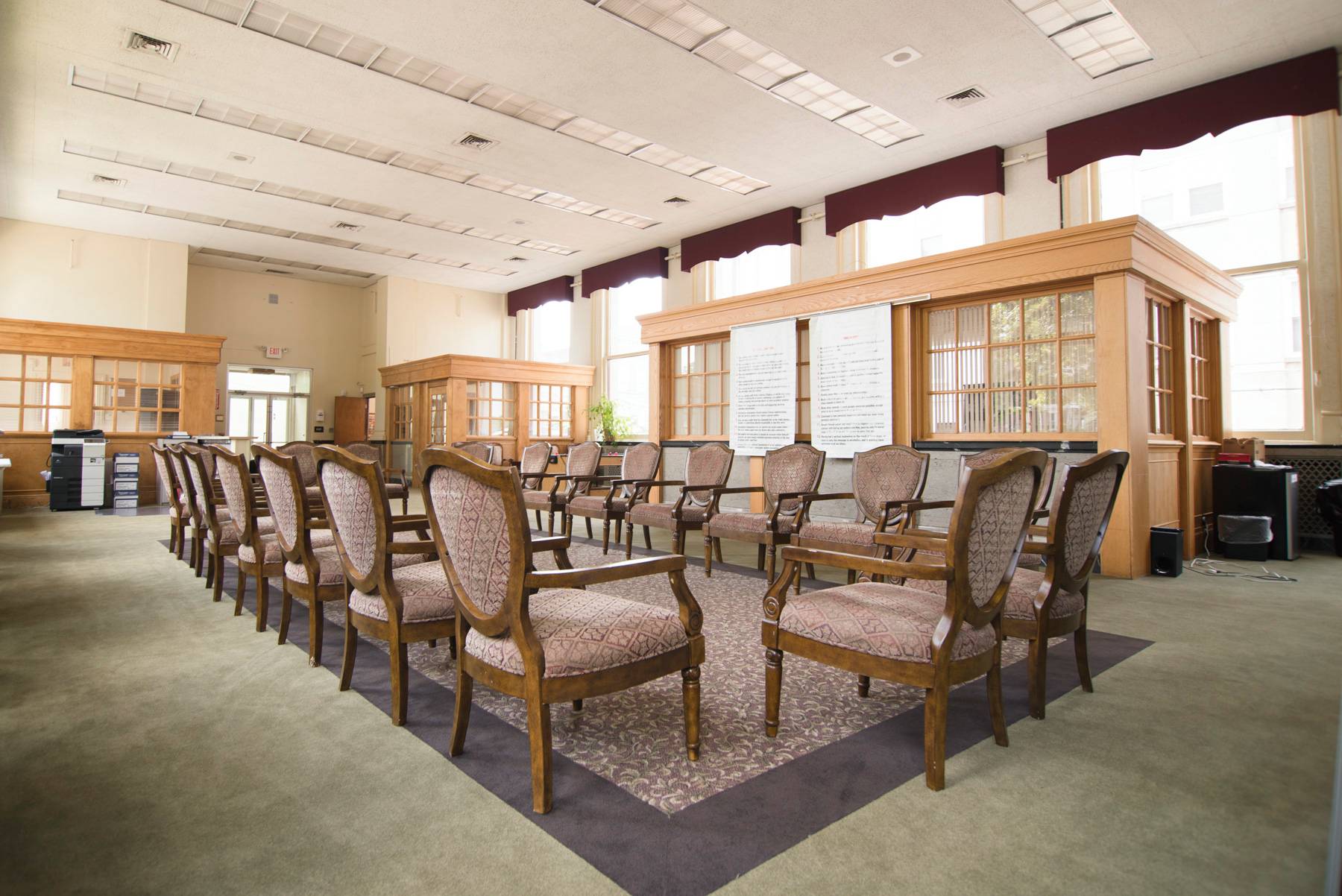 Large meeting room with armchairs in circular layout