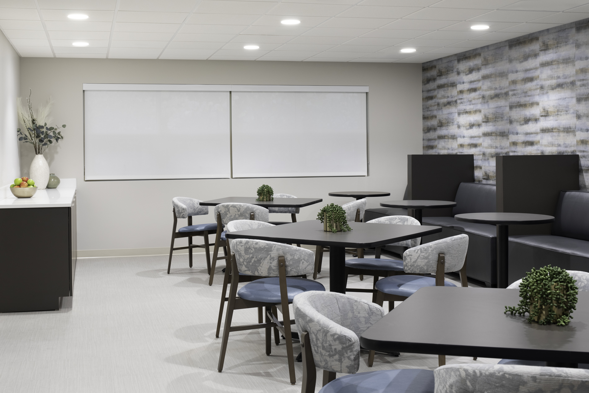 Modern dining room with black tables and gray chairs