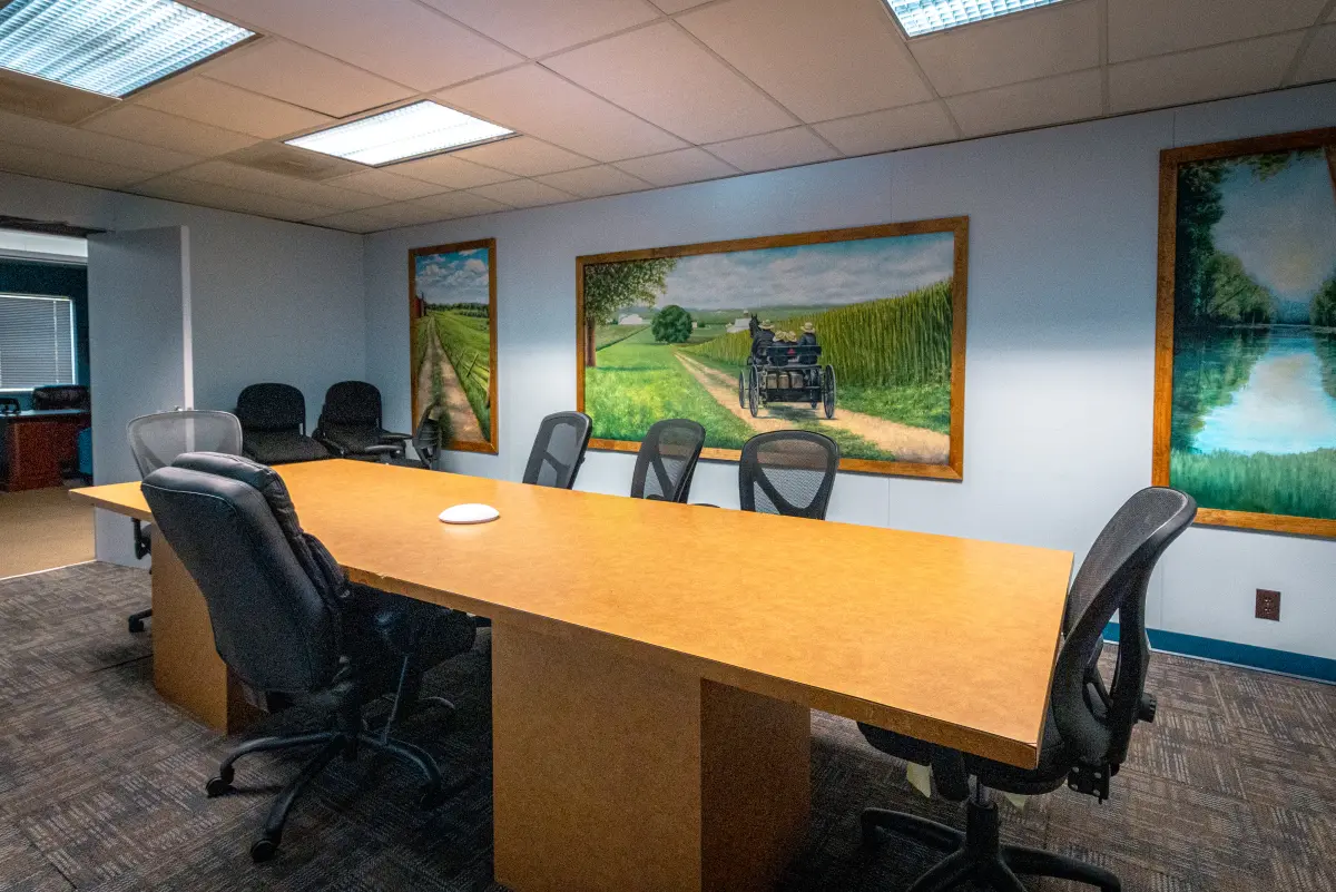 Conference room with long table and wall art