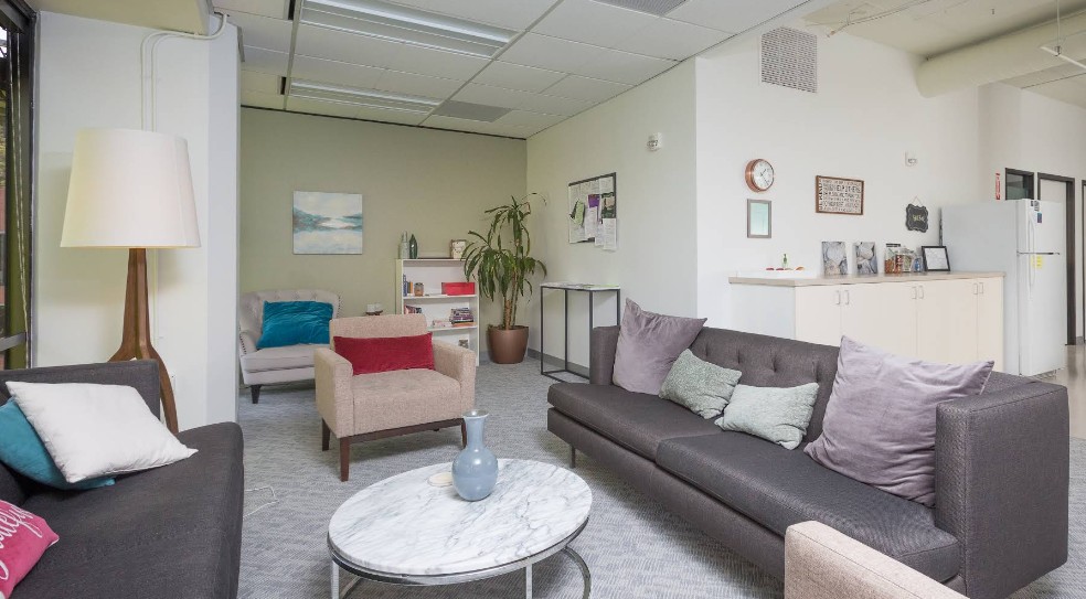 Comfortable lounge with sofas, chairs, and refreshment area
