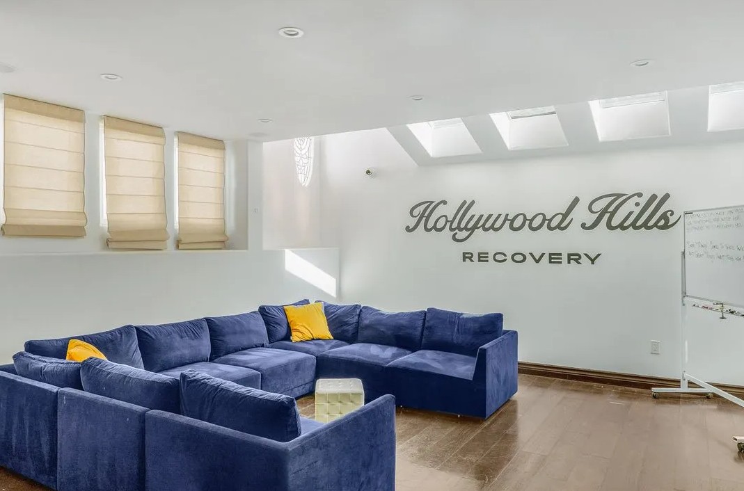 Group meeting room with sectional seating and whiteboard