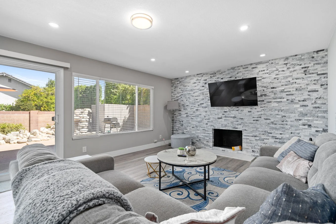 Bright living room with sectional sofa and TV