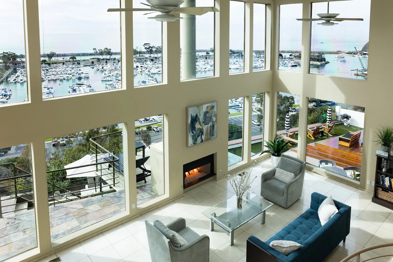Spacious living area with large windows and marina views
